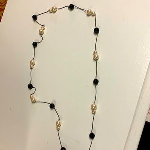Long pearl like and black bead necklace